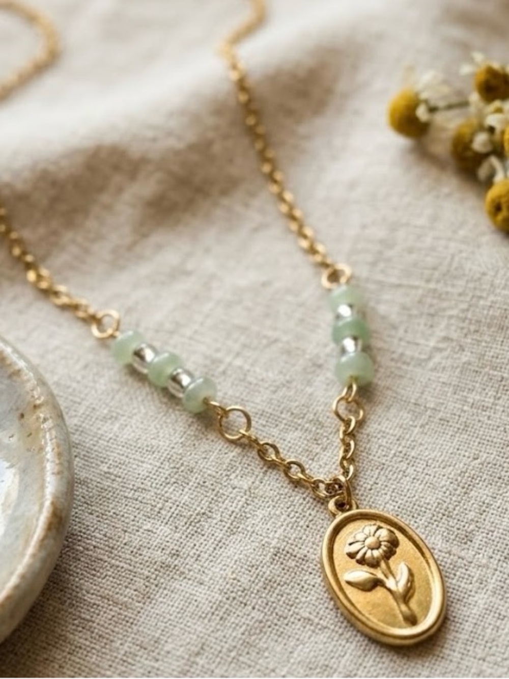 Gold Floral Oval Pendant Necklace with Pale Green Bead Accents